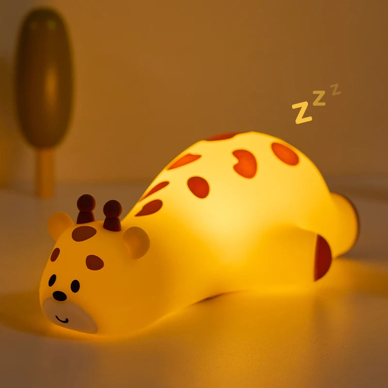 Yellow kawaii giraffe-shaped night light with brown spots on a beige background