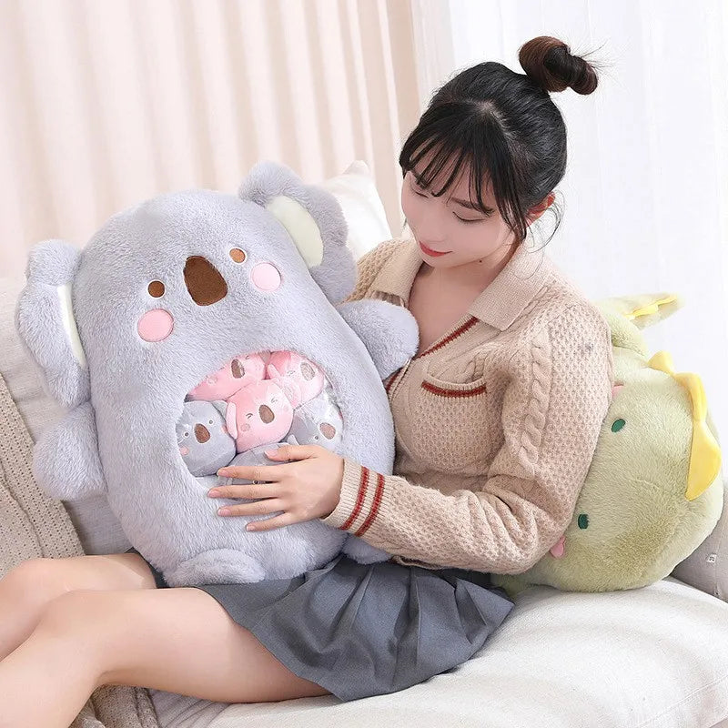 Woman holding a large koala-shaped kawaii pillow on a couch