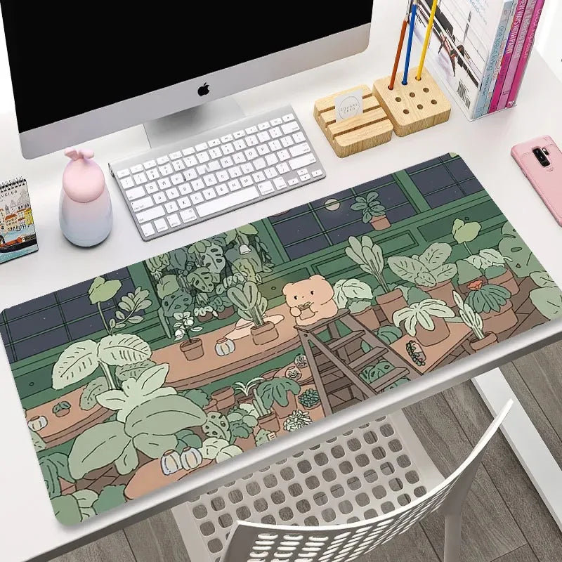 Desk setup with a decorative mouse pad featuring a Kawaii teddy bear and plants.