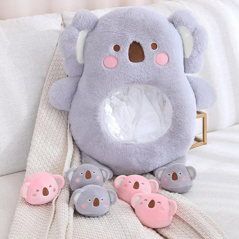 Set of kawaii plush koala toys in various sizes on a soft surface