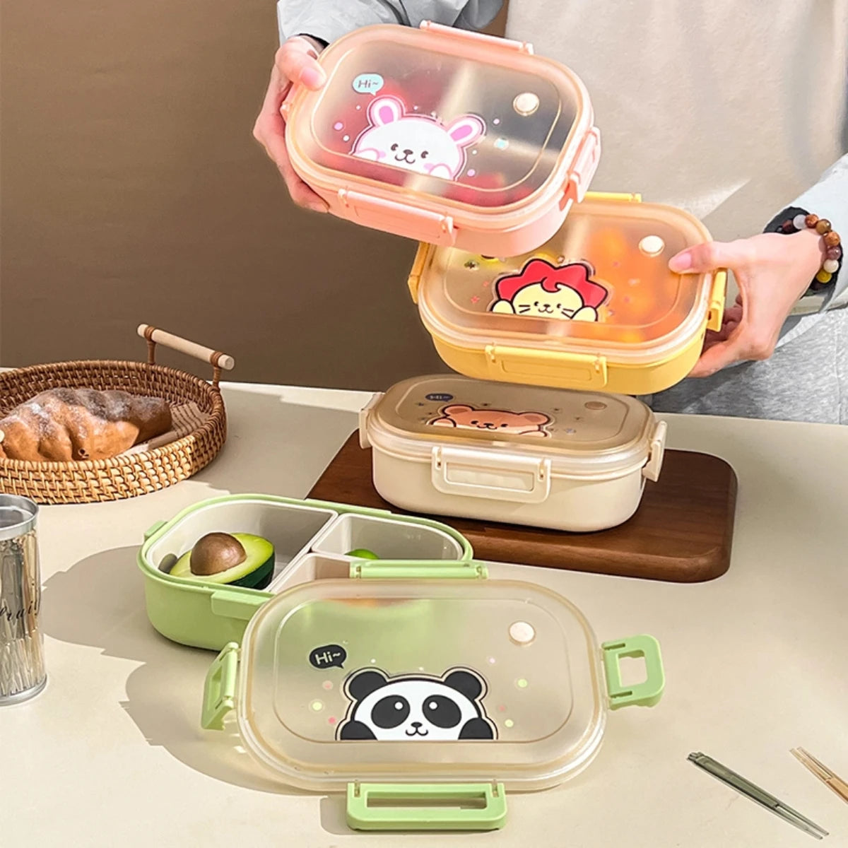 Set of kawaii colorful bento boxes with cartoon designs on a table.