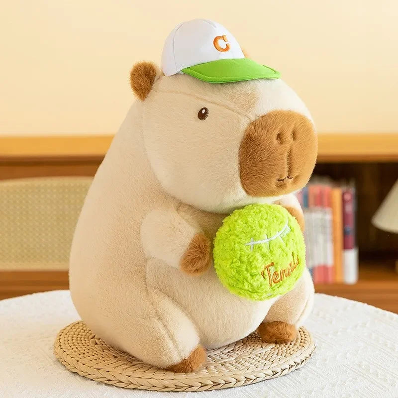 Kawaii plush toy hippo wearing a cap with a tennis ball on a woven coaster