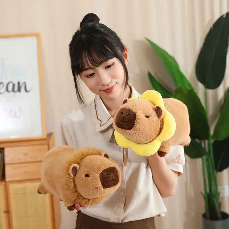 Woman holding two kawaii plush lion toys in a room with a plant and framed picture.