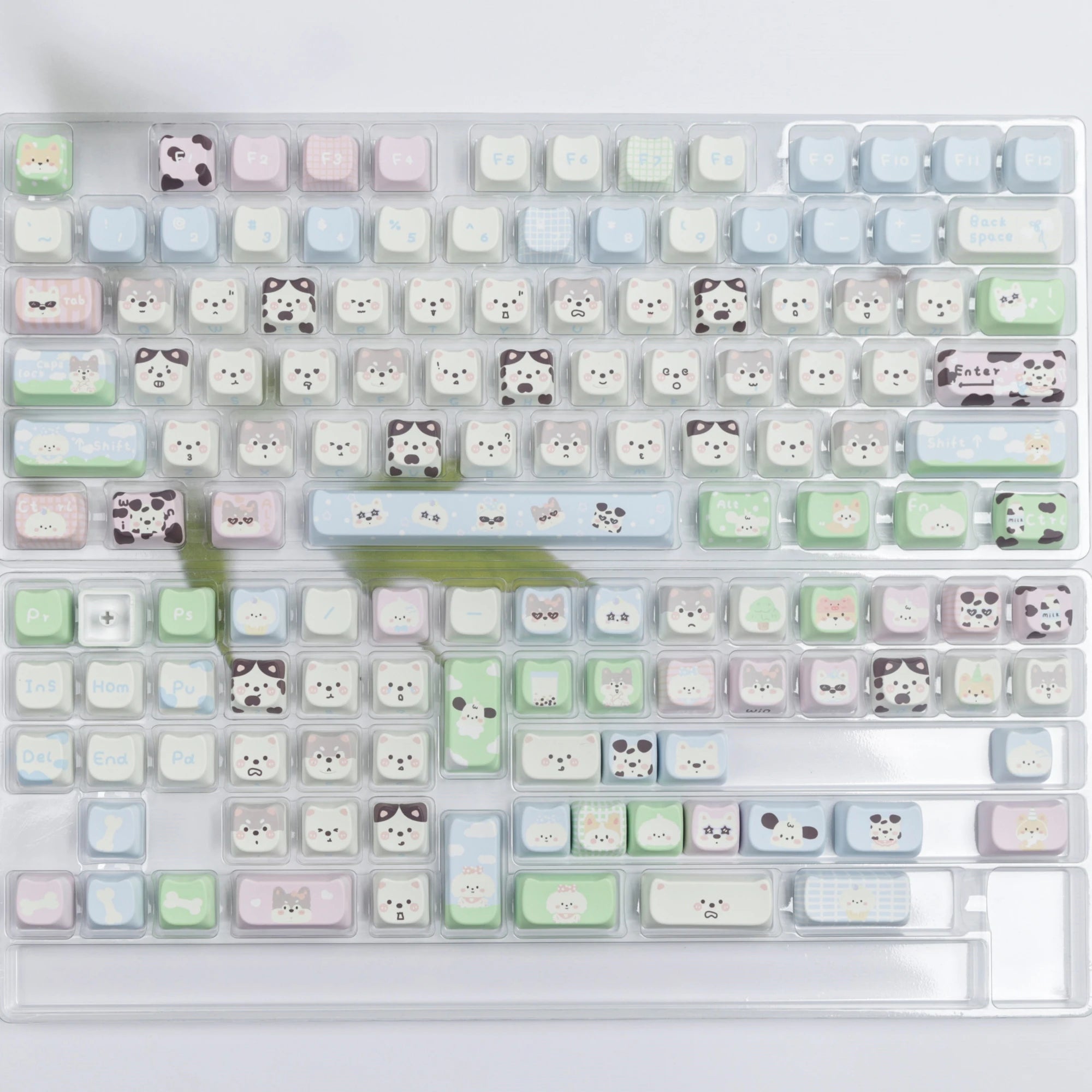 Keyboard with kawaii cute animal-themed keycaps on a white background