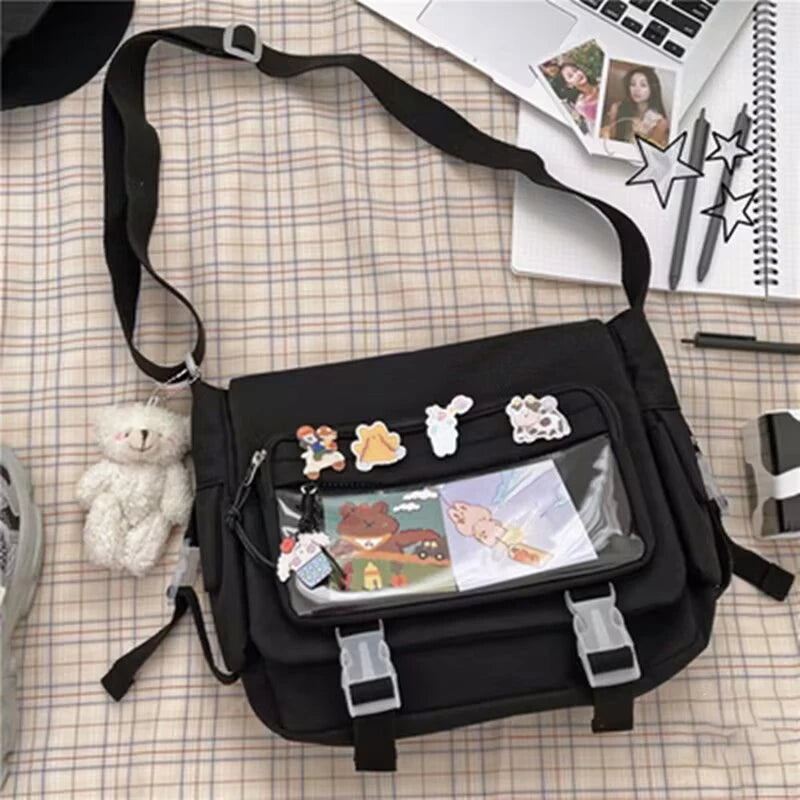 Black bag with Kawaii cartoon character stickers on a checkered tablecloth