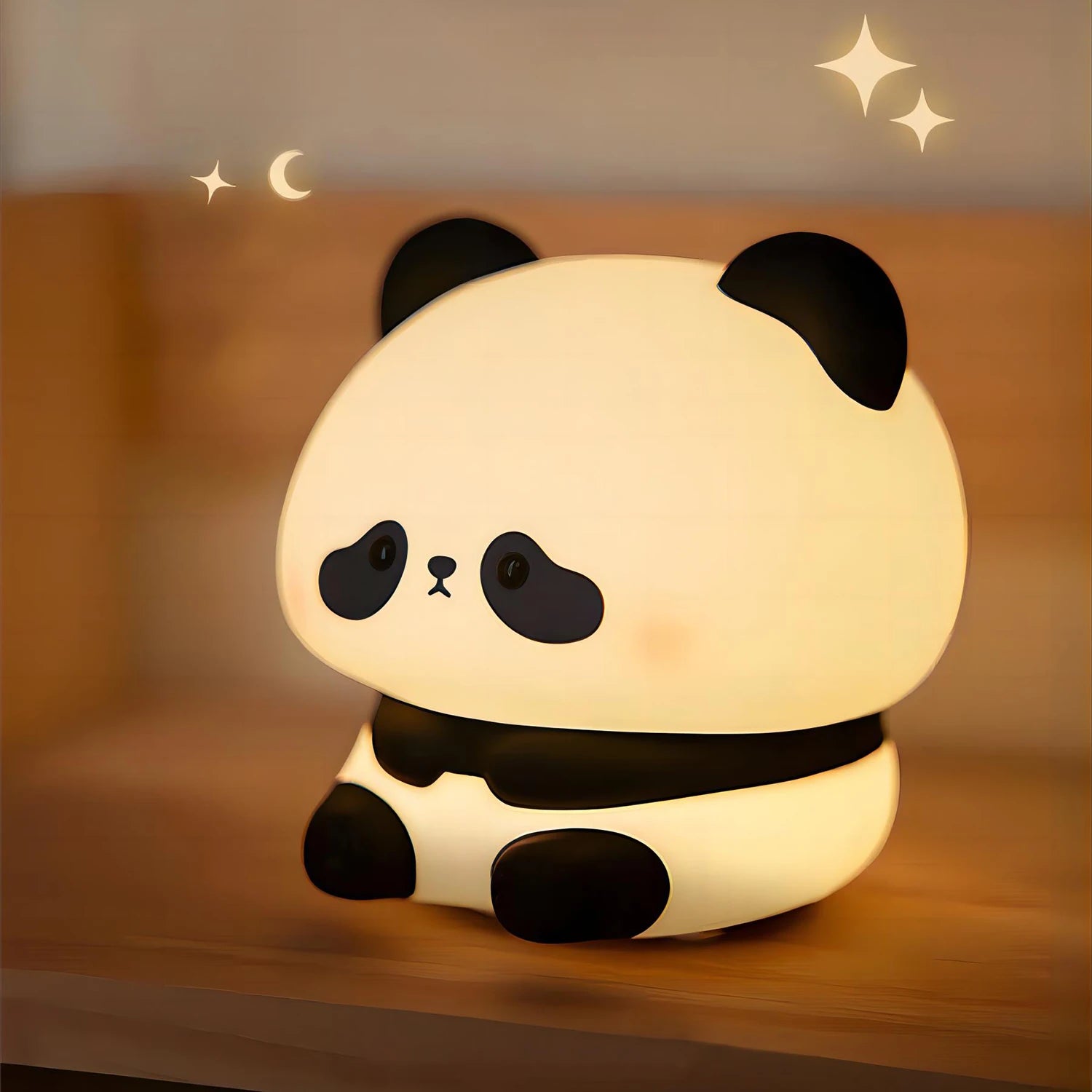 Kawaii panda-shaped night light on a wooden surface with a warm glow