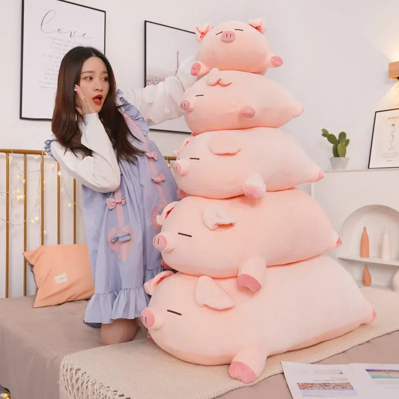 Woman in a room with a large stack of pink pig-shaped kawaii plushies.