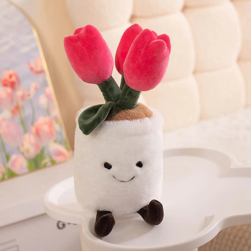 Plush kawaii toy resembling a white cup with tulips on top, sitting on a surface.