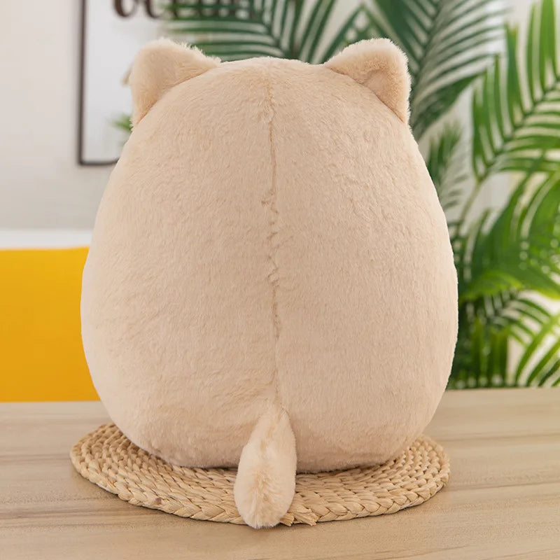 Kawaii plush toy with cat ears on a woven coaster