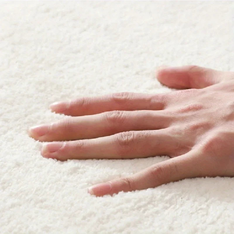 Hand touching a textured white kawaii rug