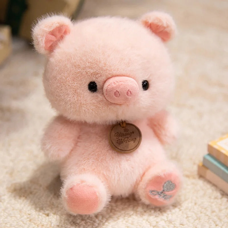 Plush pig kawaii toy with a tag on a soft surface