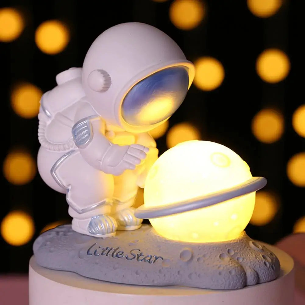 Astronaut kawaii night light with a glowing sphere on a blurred lights background