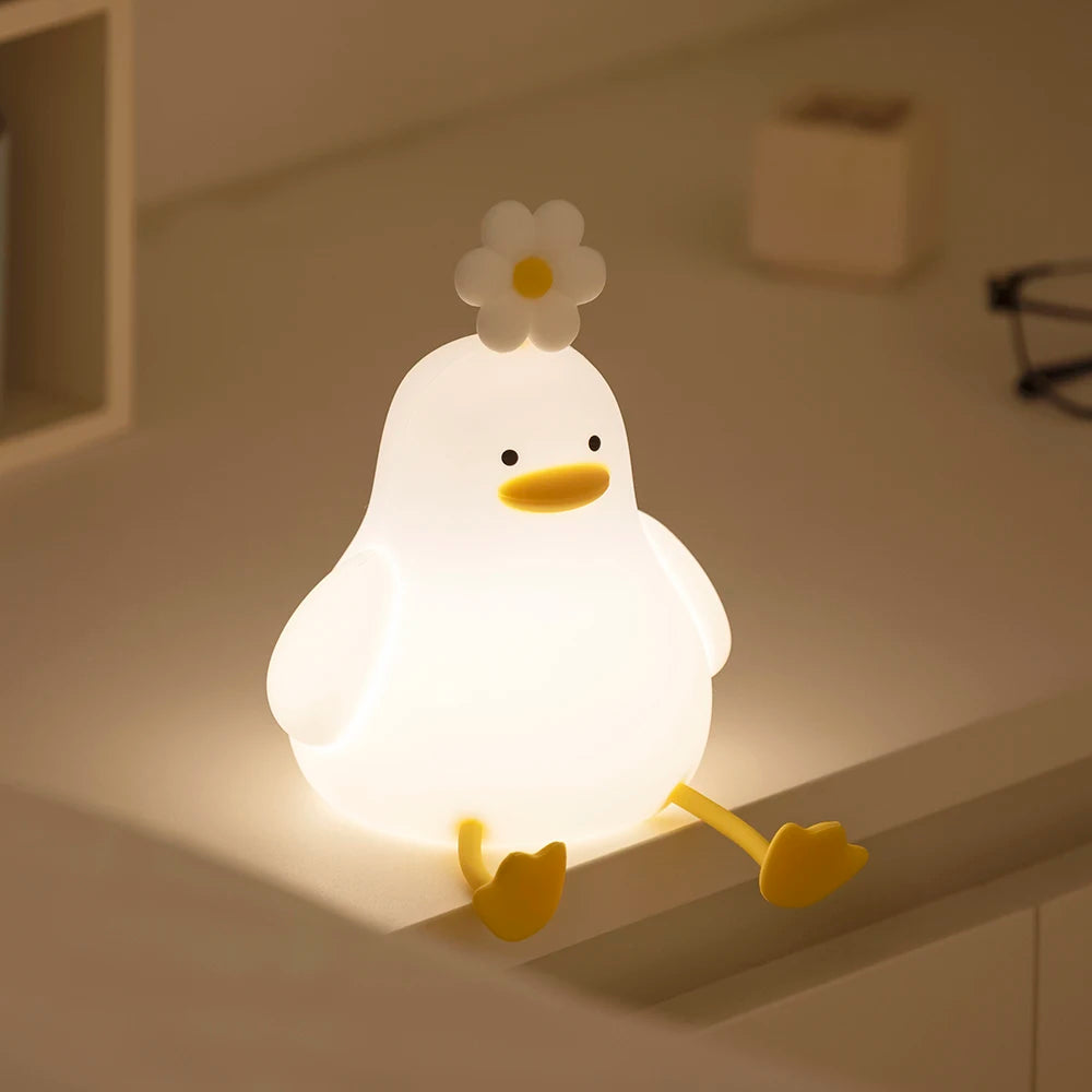Light-up chick kawaii figurine with a flower on its head, glowing softly.