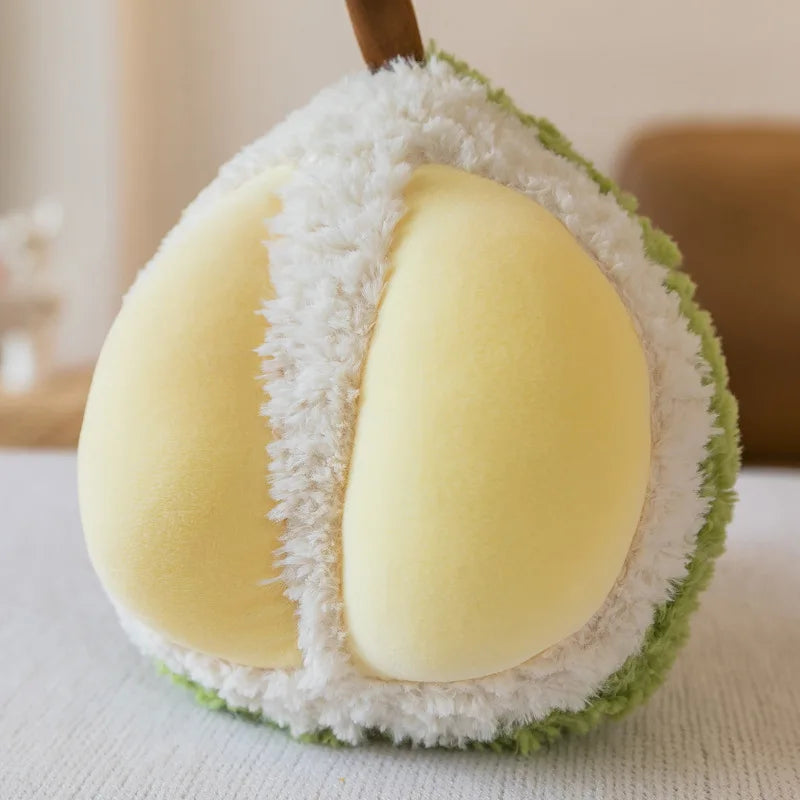 Kawaii plush toy shaped like a pear with white and green fur on a light background